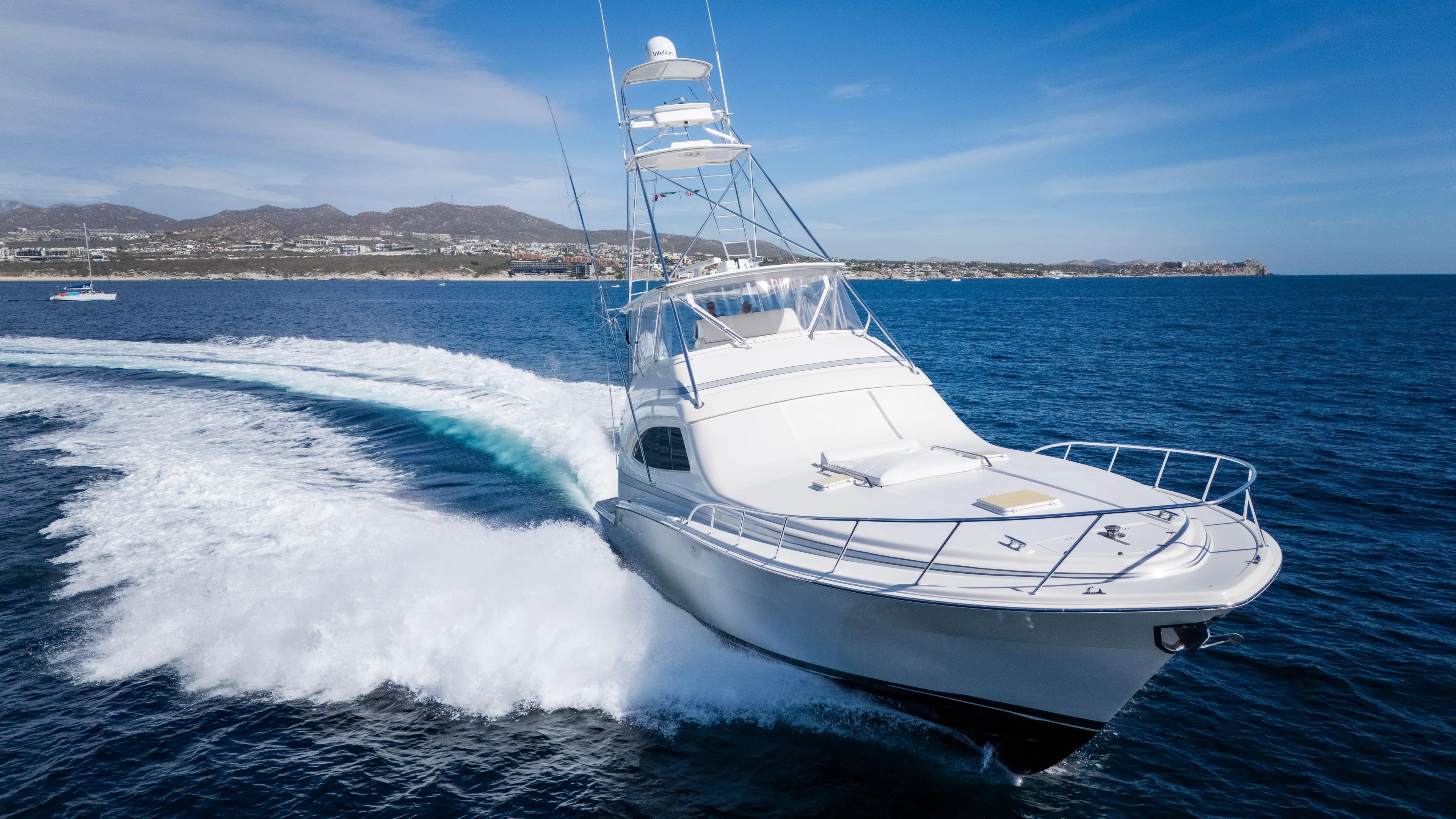 Chill 'n Yacht Photos Pics 2003 Bertram 67 Convertible yacht cruising on open water.
