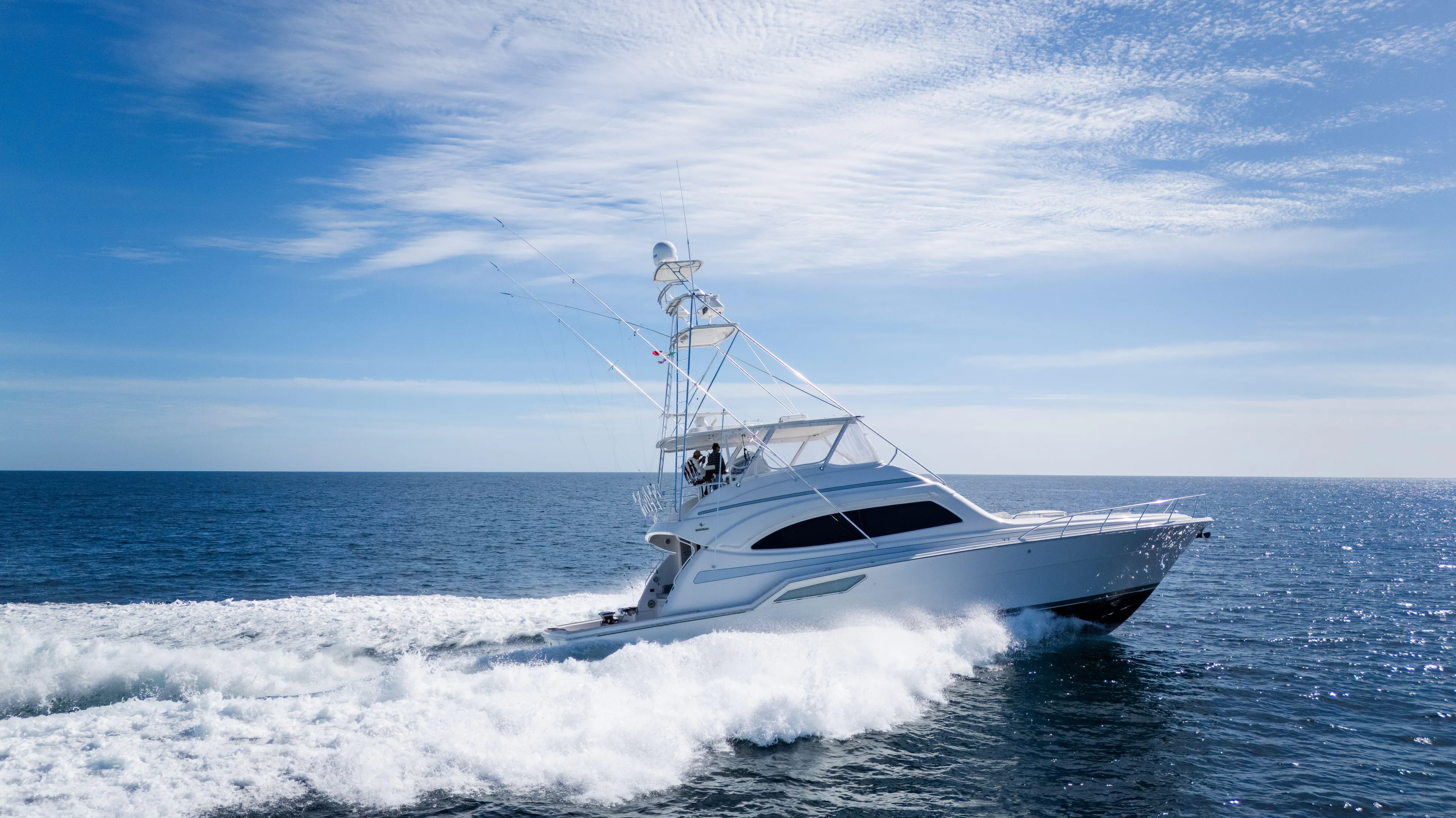 Chill 'n Yacht Photos Pics 2003 Bertram 67 Convertible yacht cruising on open sea under clear sky.