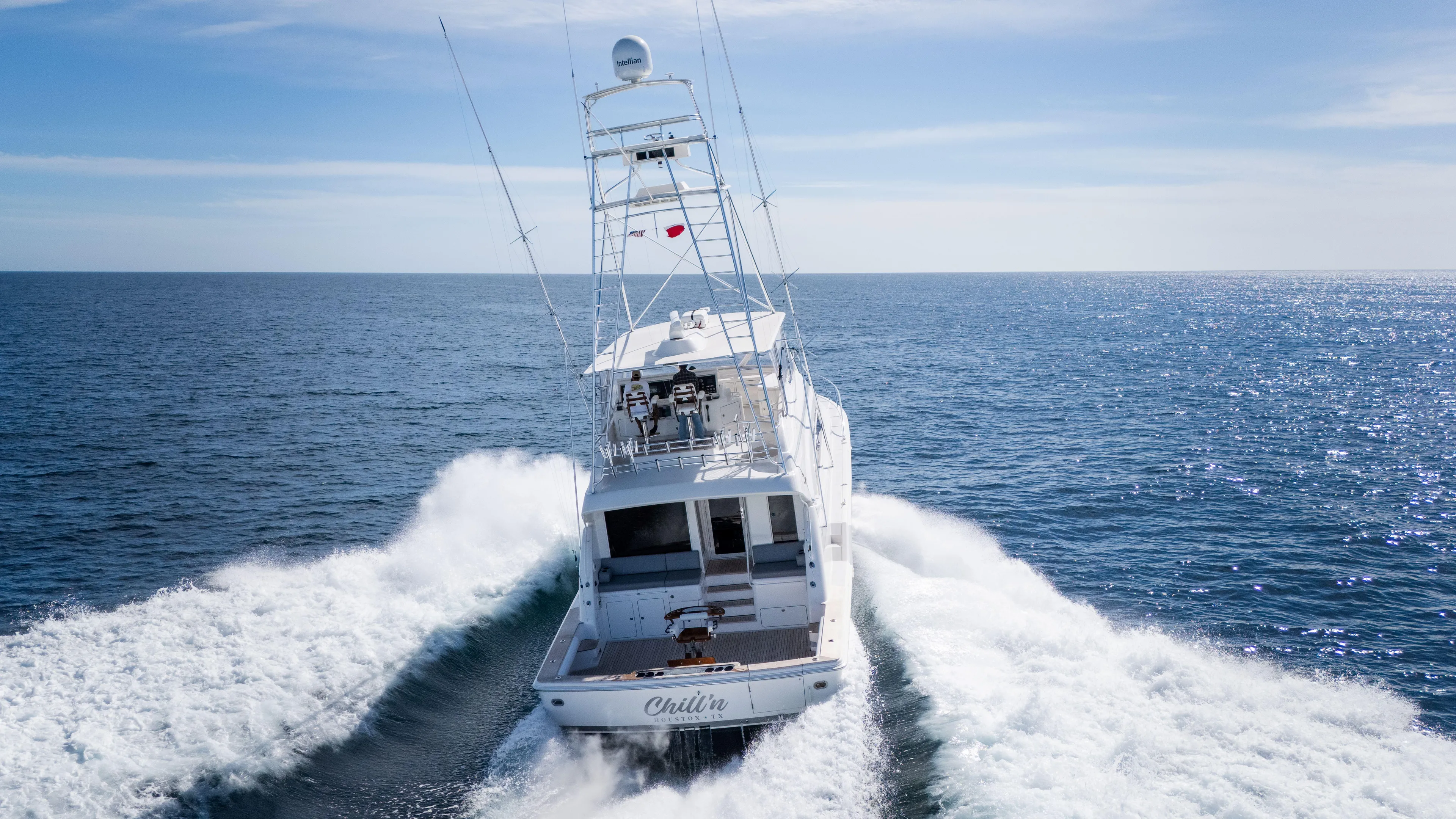 Chill 'n Yacht Photos Pics 2003 Bertram 67 Convertible yacht cruising on open ocean waters.