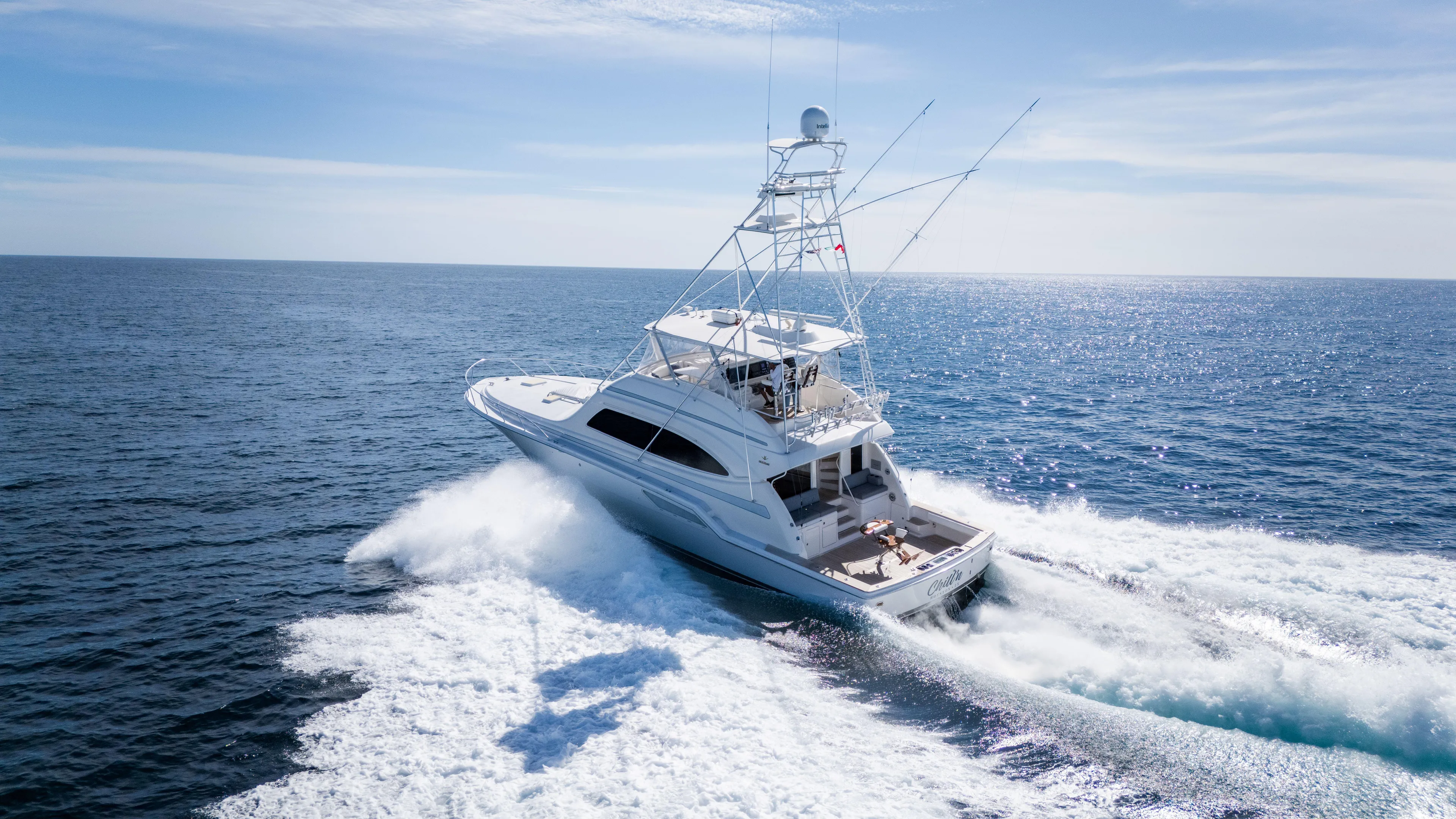 Chill 'n Yacht Photos Pics 2003 Bertram 67 Convertible yacht cruising on open ocean waters.