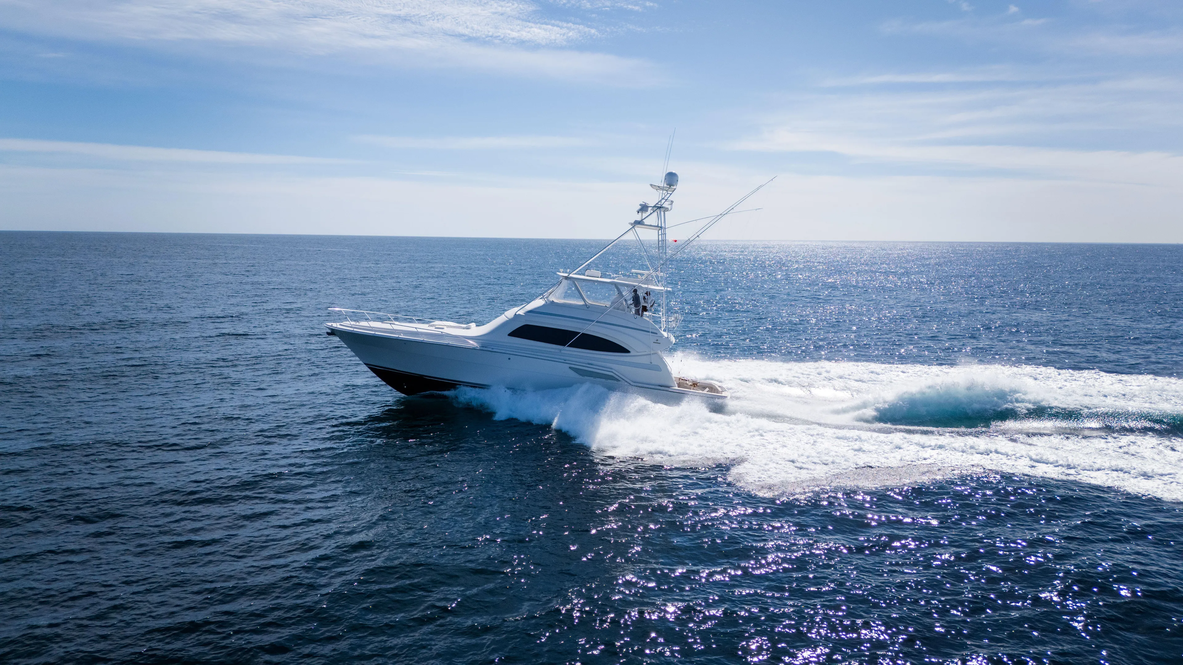 Chill 'n Yacht Photos Pics 2003 Bertram 67 Convertible yacht cruising on open ocean waters.