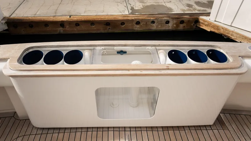 Chill 'n Yacht Photos Pics 2003 Bertram 67 Convertible yacht fishing station with rod holders and storage.