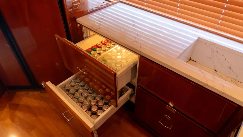 Chill 'n Yacht Photos Pics Luxury yacht kitchen with open beverage drawers, Bertram 67 Convertible, 2003 model.