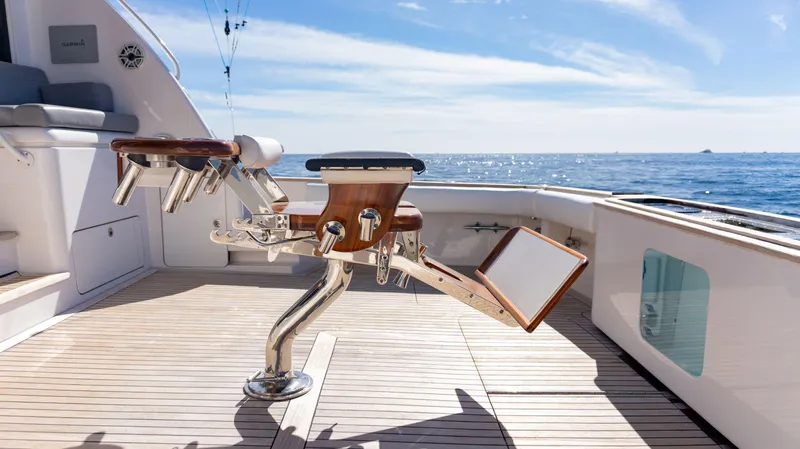 Chill 'n Yacht Photos Pics 2003 Bertram 67 Convertible yacht deck with fishing chair, ocean view.