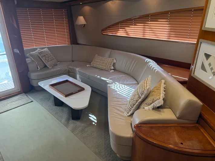 Chill 'n Yacht Photos Pics Luxurious interior of a 2003 Bertram 67 Convertible yacht with elegant seating and decor.