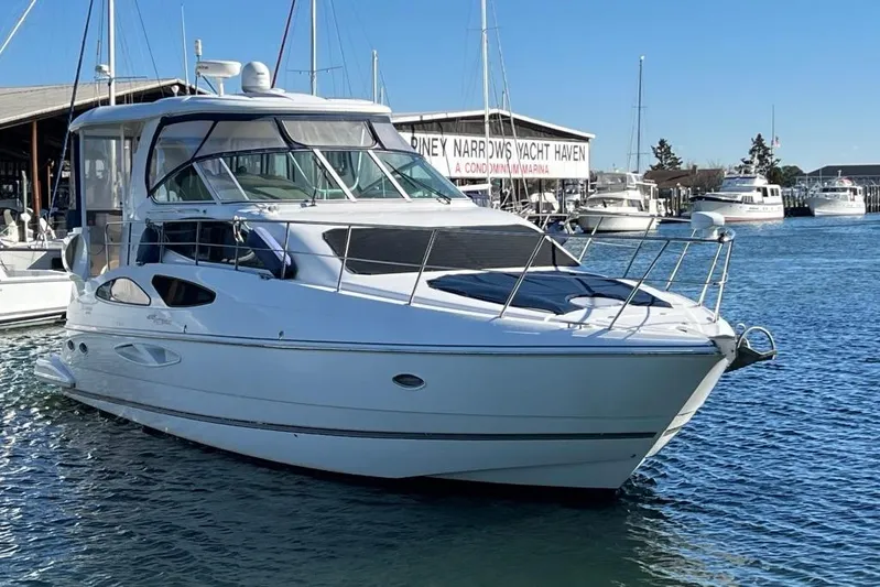  Yacht Photos Pics 2008 Cruisers 455 Motor Yacht docked at a marina under clear blue skies.