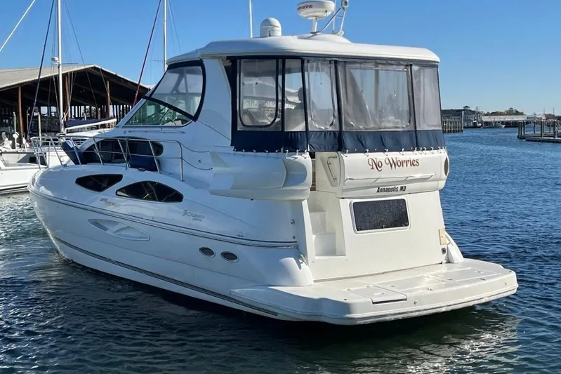  Yacht Photos Pics 2008 Cruisers 455 Motor Yacht docked in a marina, clear blue sky.