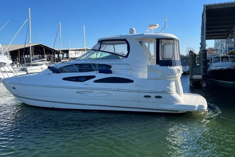  Yacht Photos Pics 2008 Cruisers 455 Motor Yacht docked at marina under clear blue sky.