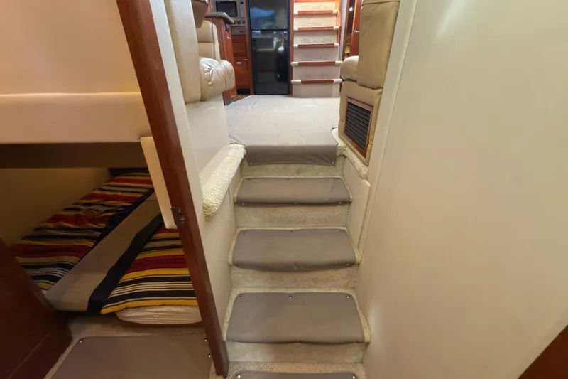  Yacht Photos Pics Interior of 2008 Cruisers 455 Motor Yacht with stairs and cozy cabin.