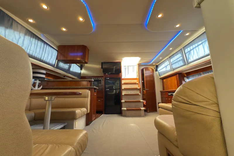  Yacht Photos Pics Luxurious interior of 2008 Cruisers 455 Motor Yacht with elegant seating and ambient lighting.