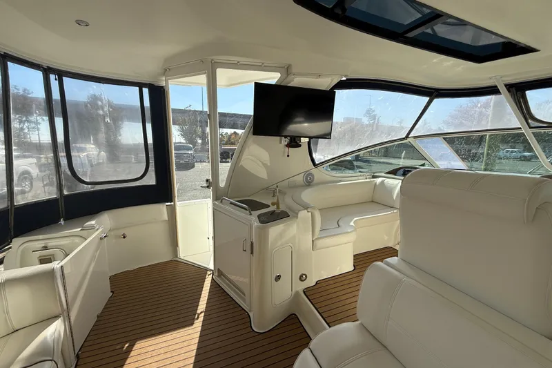  Yacht Photos Pics Luxurious interior of 2008 Cruisers 455 Motor Yacht with white seating and wood flooring.