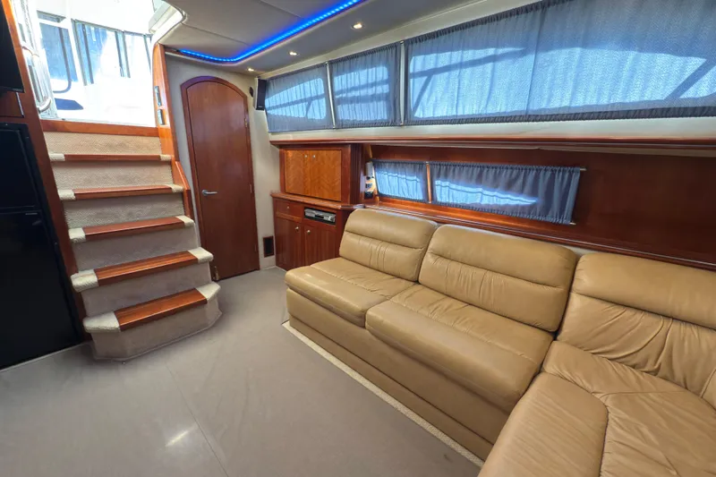  Yacht Photos Pics Luxurious interior of 2008 Cruisers 455 Motor Yacht with beige leather seating and wooden accents.