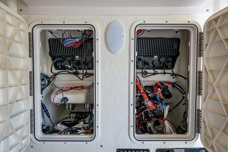  Yacht Photos Pics 2022 Sailfish 272CC boat wiring compartments with organized cables and components.