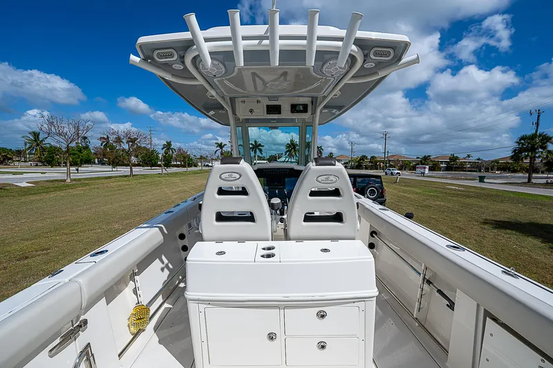  Yacht Photos Pics 2022 Sailfish 272CC boat interior with dual seats and storage compartments.
