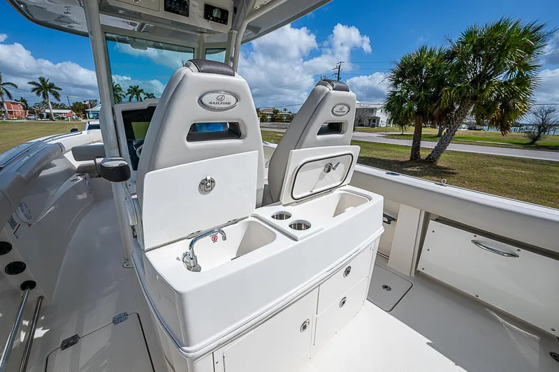  Yacht Photos Pics 2022 Sailfish 272CC boat interior with dual seats and storage compartments.