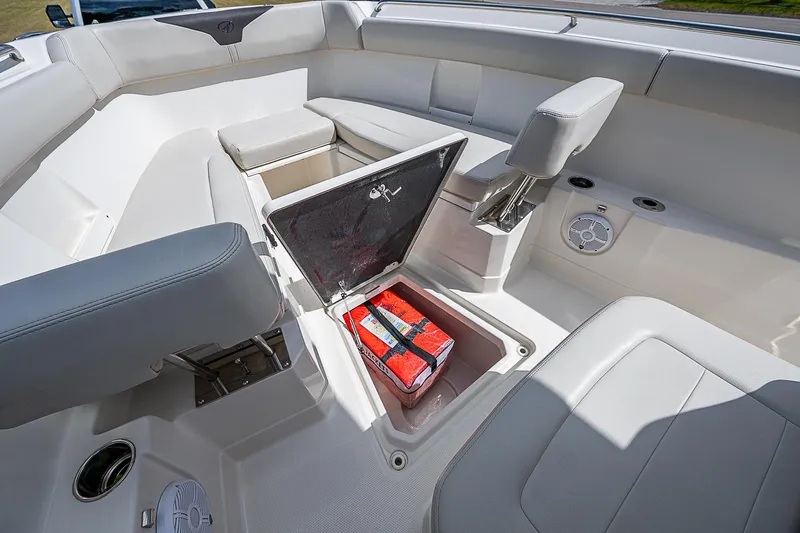  Yacht Photos Pics 2022 Sailfish 272CC boat interior with open storage compartment and seating.