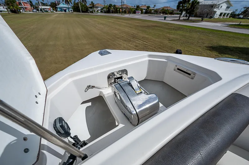  Yacht Photos Pics 2022 Sailfish 272CC boat anchor compartment with winch, outdoor setting.