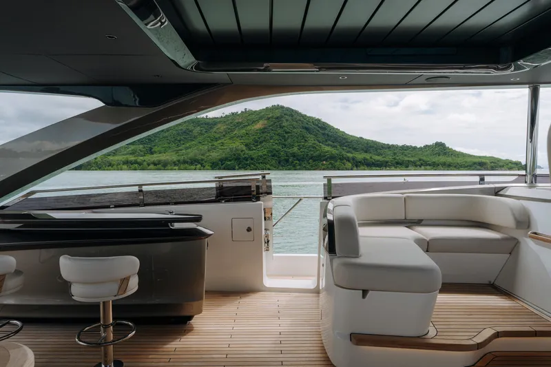  Yacht Photos Pics Luxurious 2023 Princess Y95 yacht interior with scenic ocean and island view.