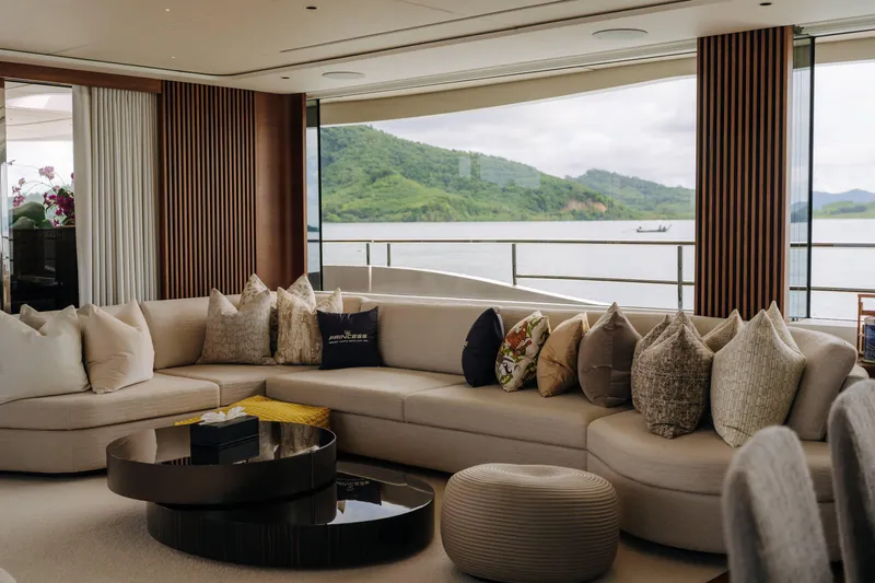 Yacht Photos Pics Luxurious interior of 2023 Princess Y95 yacht with elegant seating and scenic window view.