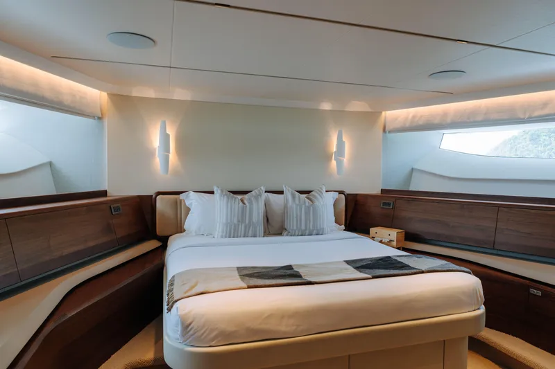  Yacht Photos Pics Luxurious bedroom interior on 2023 Princess Y95 yacht, featuring elegant design and ambient lighting.