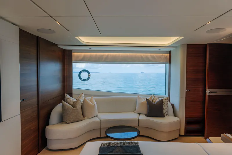  Yacht Photos Pics Luxurious interior of 2023 Princess Y95 yacht with ocean view through large window.