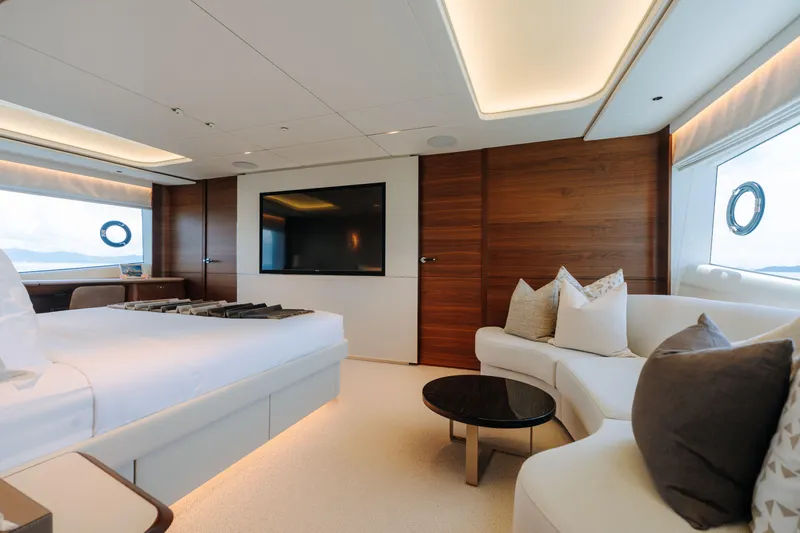  Yacht Photos Pics Luxurious interior of 2023 Princess Y95 yacht with modern furnishings and large TV.