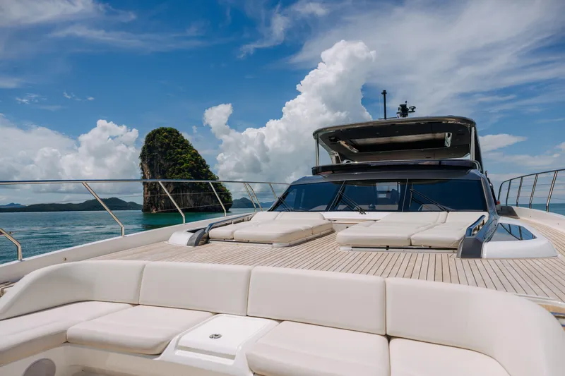  Yacht Photos Pics Luxurious 2023 Princess Y95 yacht deck with scenic ocean and island view.