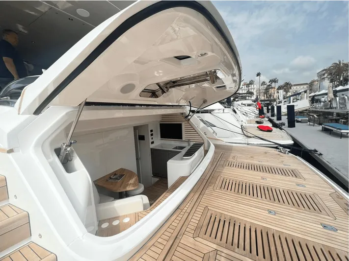  Yacht Photos Pics Luxurious 2023 Princess Y95 yacht with open deck and modern interior at marina.