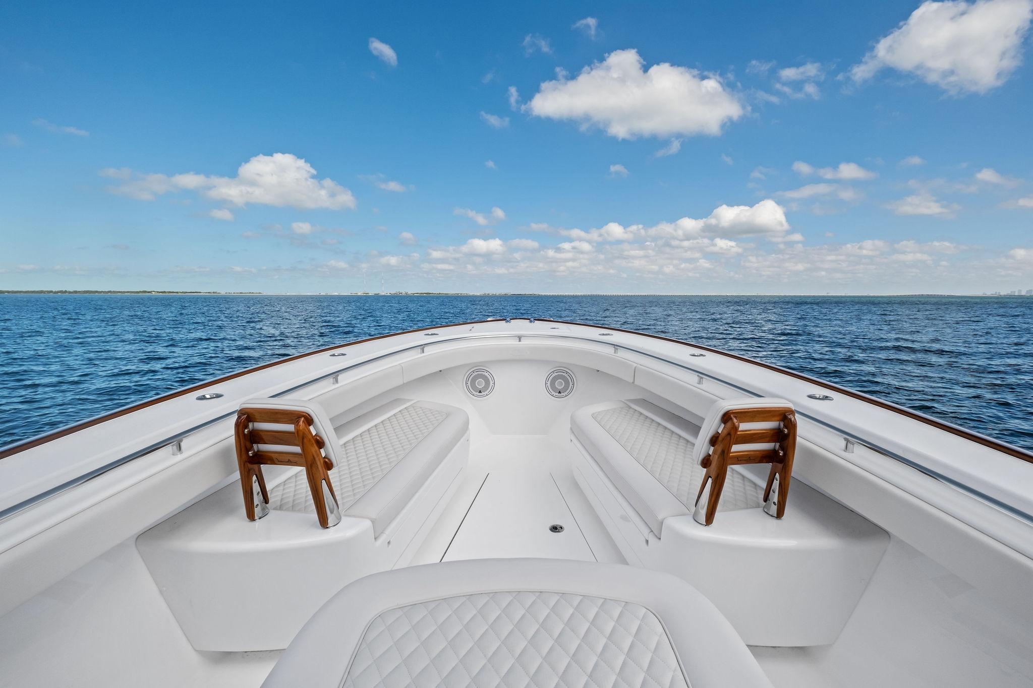 2026 Valhalla Boatworks V-37 on open water, showcasing spacious seating and clear skies.