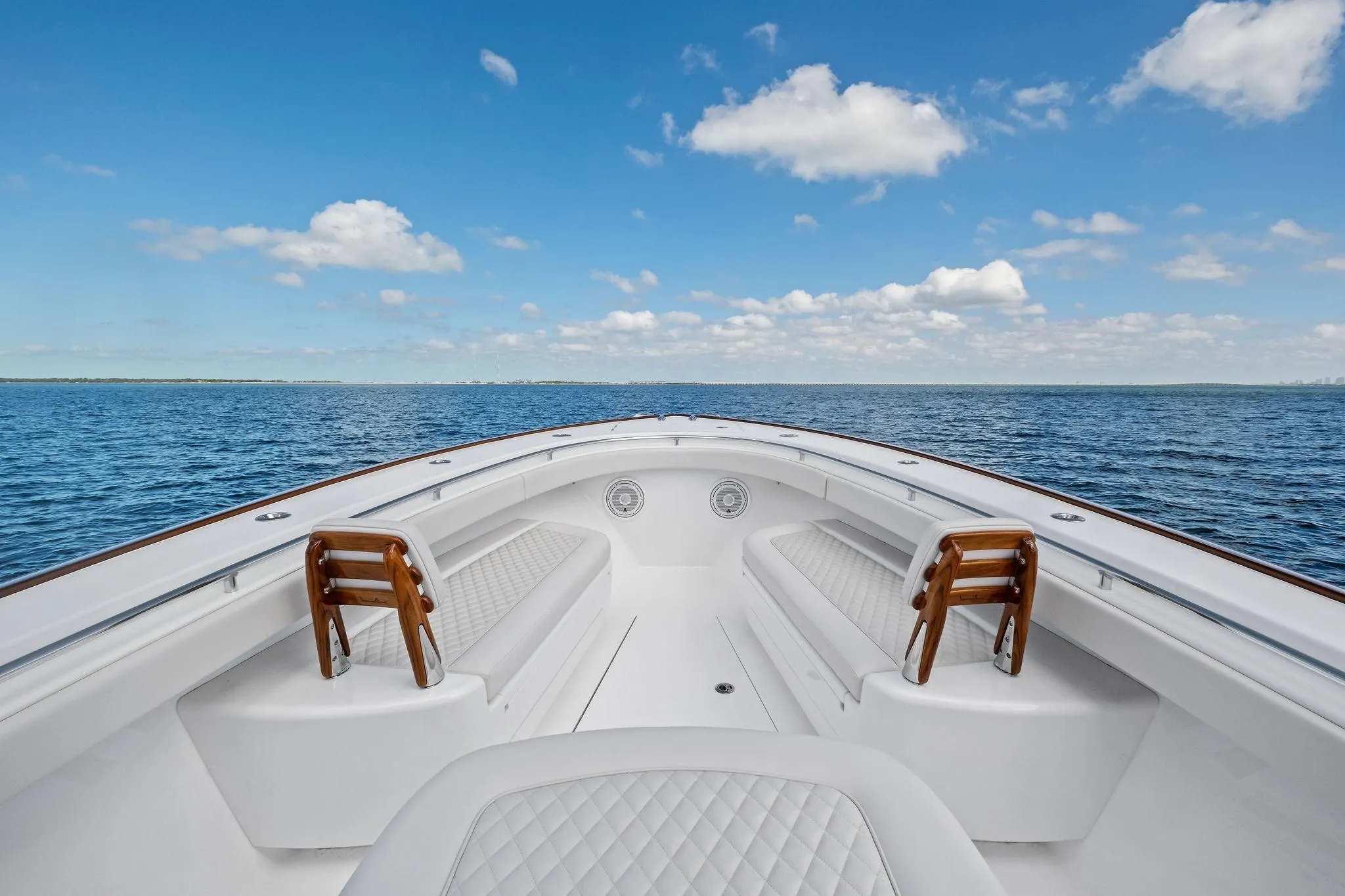 2026 Valhalla Boatworks V-37 on open water, showcasing spacious seating and clear skies.