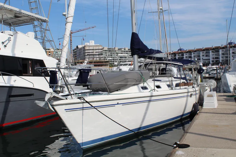 Cuckoo's Nest II Yacht Photos Pics 2002 Catalina MkII sailboat docked at marina with modern buildings in background.