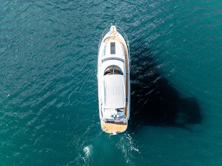 Duet Yacht Photos Pics Aerial view of 2024 Nimbus 405 Flybridge yacht on blue ocean water.