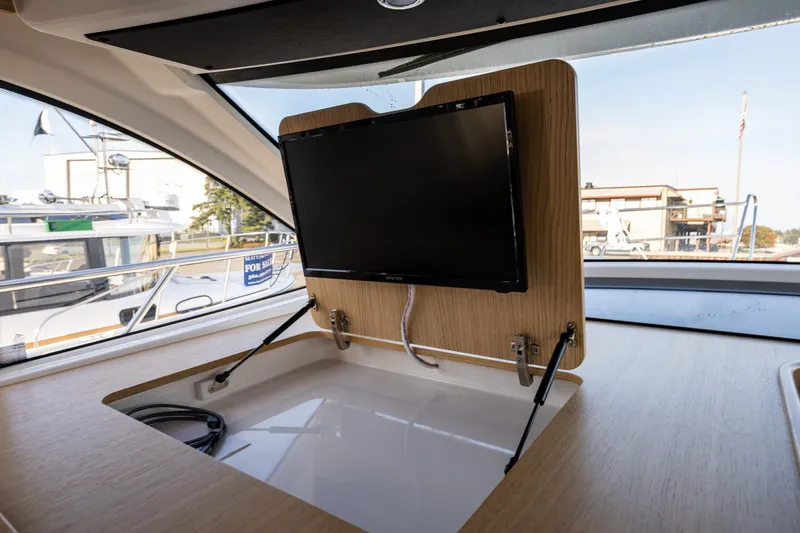 Duet Yacht Photos Pics 2024 Nimbus 405 Flybridge interior with retractable TV and modern design.
