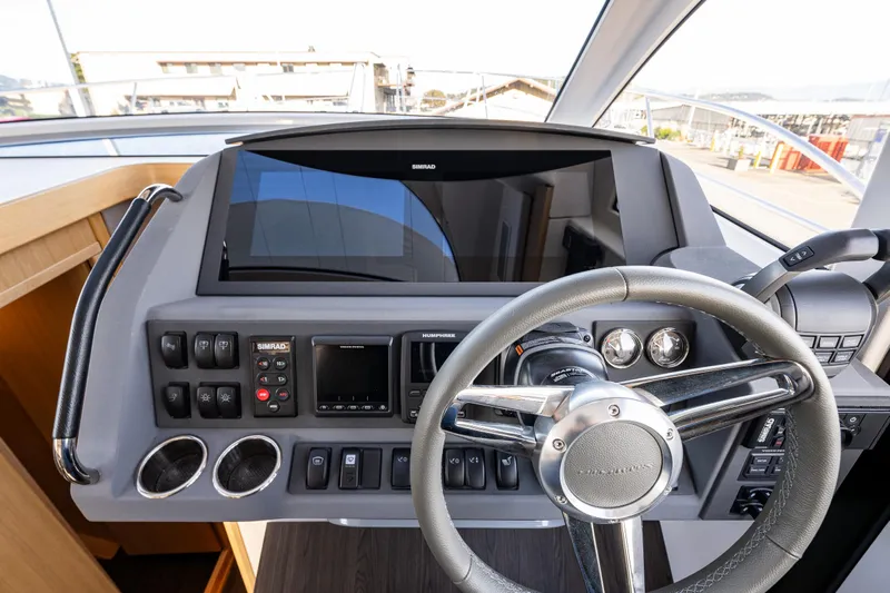 Duet Yacht Photos Pics 2024 Nimbus 405 Flybridge helm with modern controls and steering wheel.