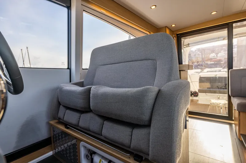 Duet Yacht Photos Pics Luxurious interior of 2024 Nimbus 405 Flybridge yacht with plush seating.