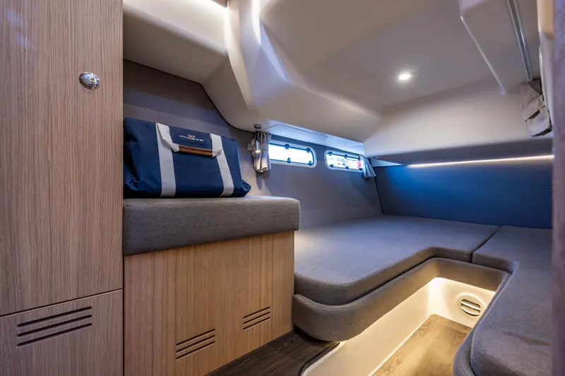 Duet Yacht Photos Pics Luxurious interior cabin of 2024 Nimbus 405 Flybridge yacht, featuring modern design and cozy seating.