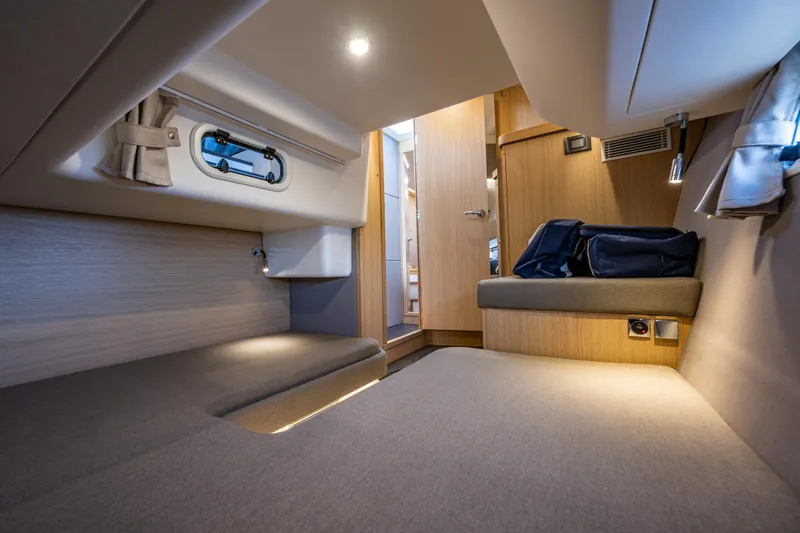 Duet Yacht Photos Pics Luxurious interior cabin of 2024 Nimbus 405 Flybridge yacht, featuring modern design and cozy seating.