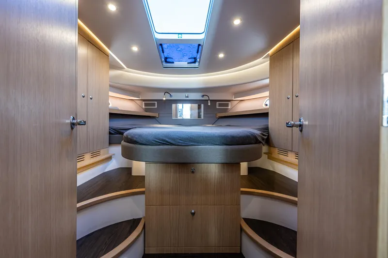 Duet Yacht Photos Pics Luxurious interior of 2024 Nimbus 405 Flybridge yacht with modern wood finish and ambient lighting.
