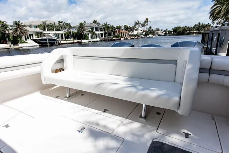  Yacht Photos Pics Luxury seating on 2016 Intrepid 400 Cuddy boat, docked by waterfront homes.