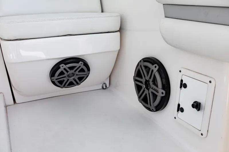  Yacht Photos Pics Interior of 2016 Intrepid 400 Cuddy featuring speakers and storage compartment.