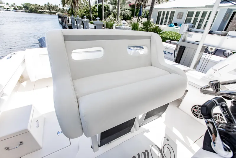  Yacht Photos Pics 2016 Intrepid 400 Cuddy boat interior with plush seating and modern controls.