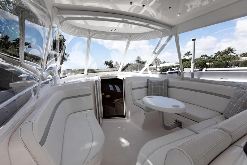  Yacht Photos Pics Luxurious interior of 2016 Intrepid 400 Cuddy boat with plush seating and table.