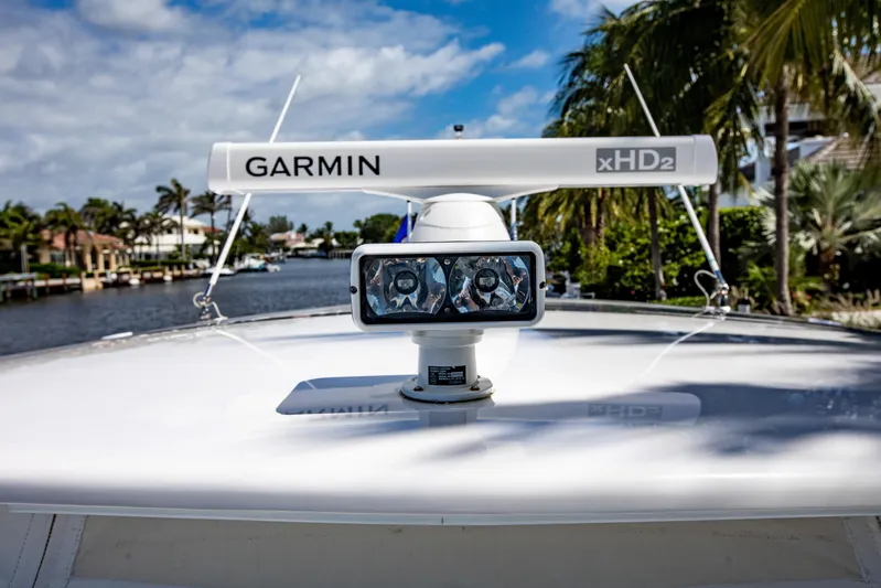  Yacht Photos Pics 2016 Intrepid 400 Cuddy boat with Garmin xHD2 radar on deck, tropical background.