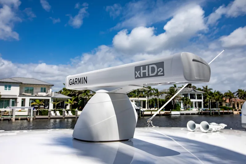  Yacht Photos Pics Garmin xHD2 radar on 2016 Intrepid 400 Cuddy boat, with waterfront homes in background.