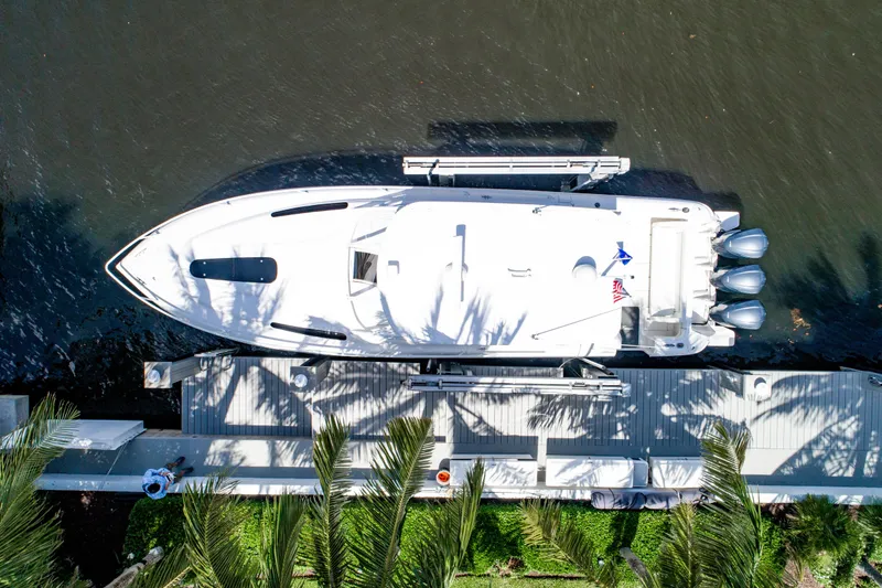  Yacht Photos Pics Aerial view of 2016 Intrepid 400 Cuddy boat docked by a pier.