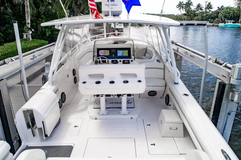  Yacht Photos Pics 2016 Intrepid 400 Cuddy boat interior with helm, seating, and navigation equipment.
