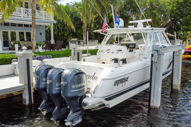  Yacht Photos Pics 2016 Intrepid 400 Cuddy boat docked with triple Yamaha engines.