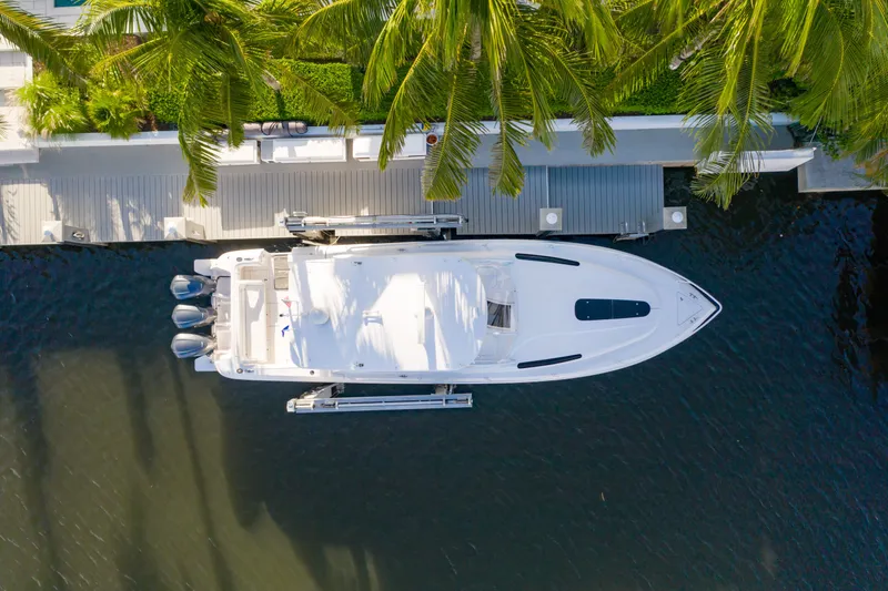  Yacht Photos Pics Aerial view of 2016 Intrepid 400 Cuddy yacht docked by palm trees.