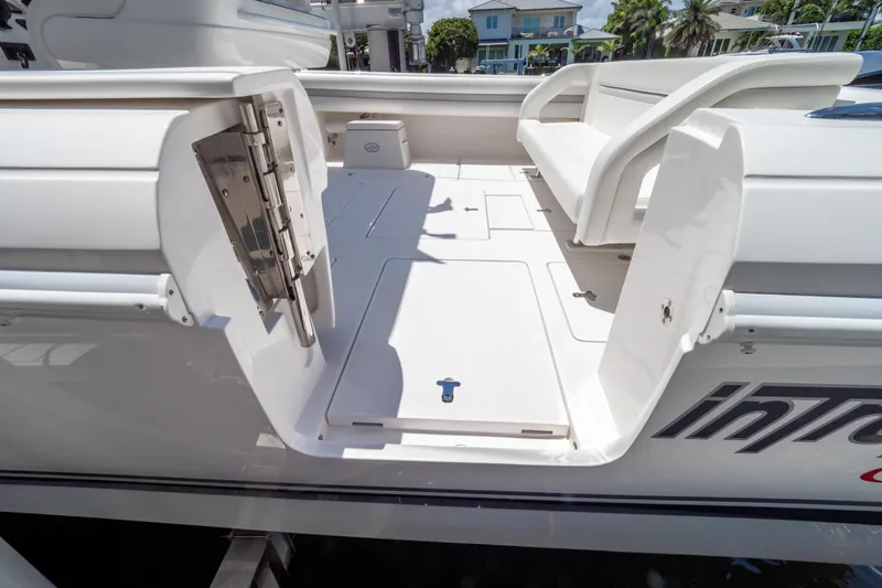  Yacht Photos Pics 2016 Intrepid 400 Cuddy boat interior with open hatch and seating area.