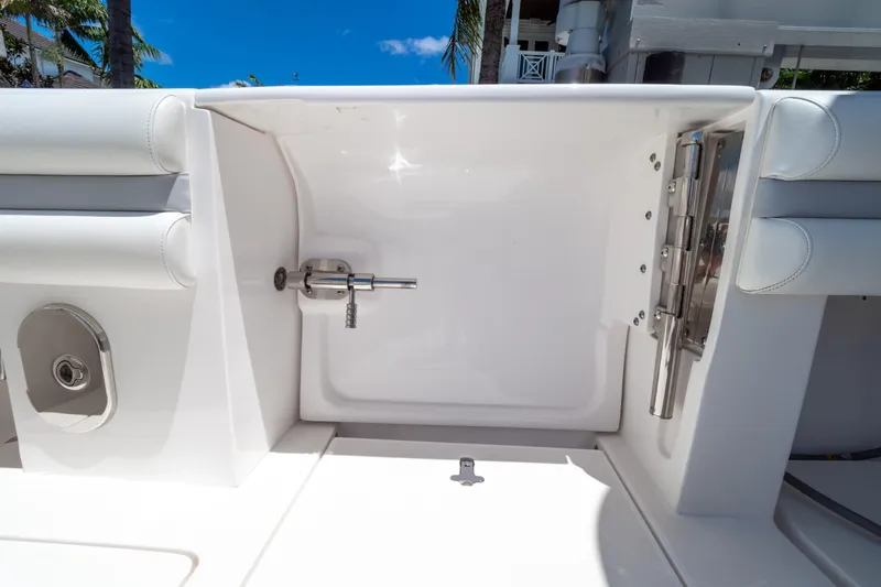  Yacht Photos Pics 2016 Intrepid 400 Cuddy boat interior detail with white seating and stainless steel fixtures.